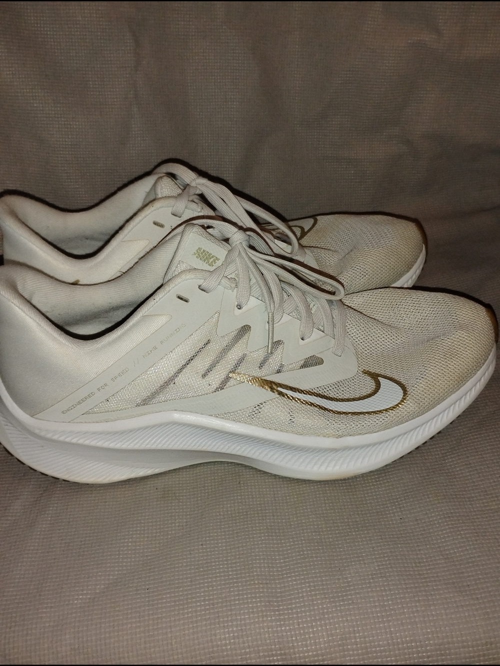 Nike Women's White Sneakers with Gold Swoosh